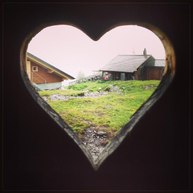 heart-shaped window in an Alps outhouse