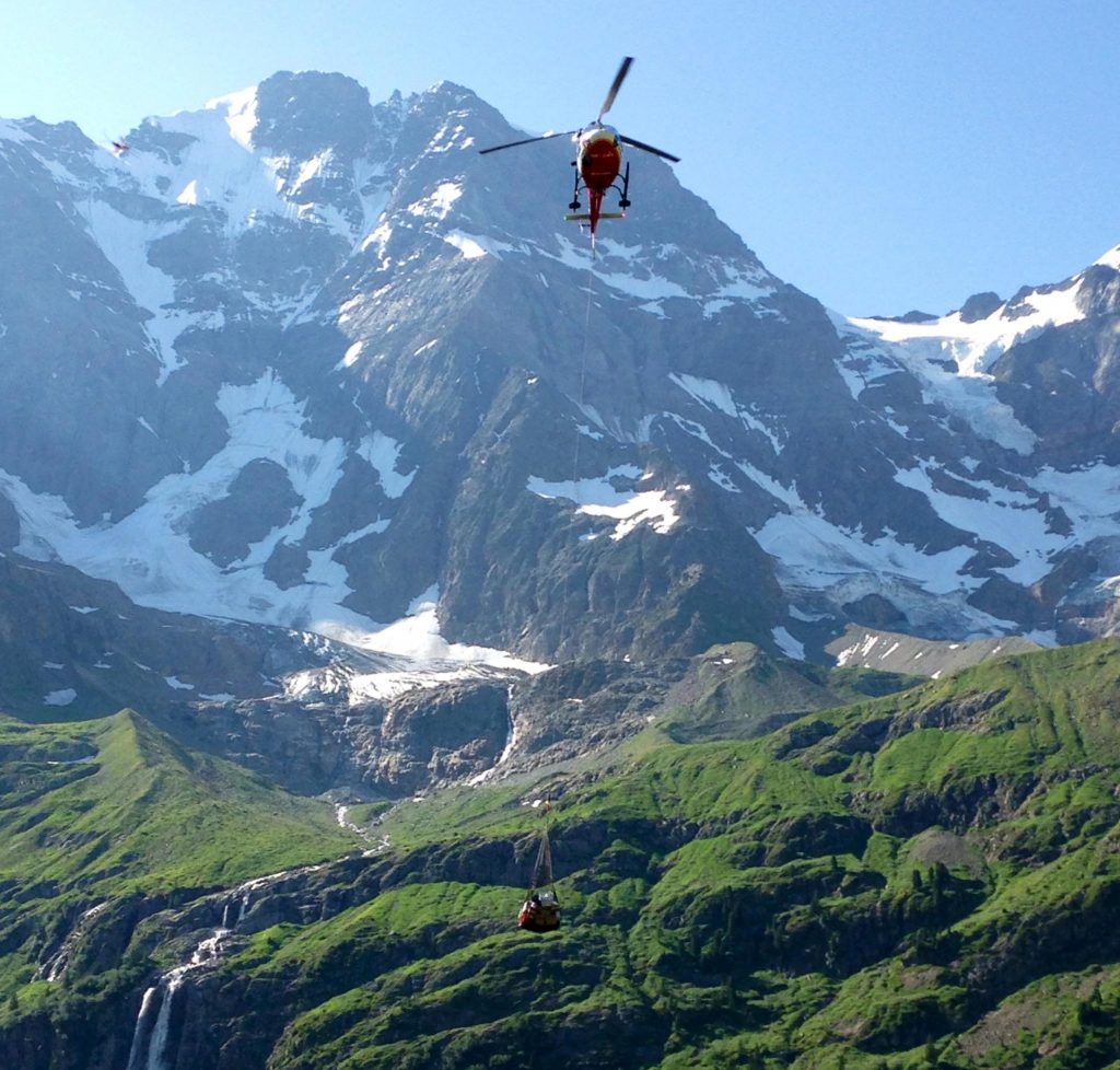 helicopter delivering supplies to Hotel Obersteinberg, Swiss Alps
