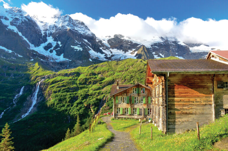 authentic Swiss mountain inn Obersteinberg with mountains and waterfall