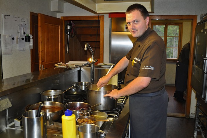 owner and chef in the kitchen, Alps mountain hotel