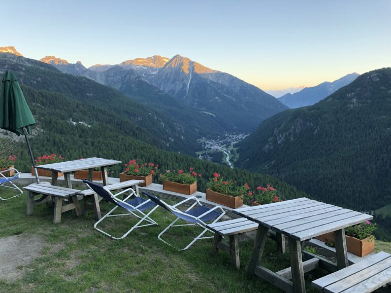 terrace seating at Rifugio Frachey view of mountains and St Jacques in valley below