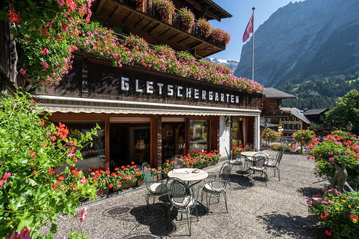 iconic Swiss Hotel Gletschergarten dining patio and flower boxes 
